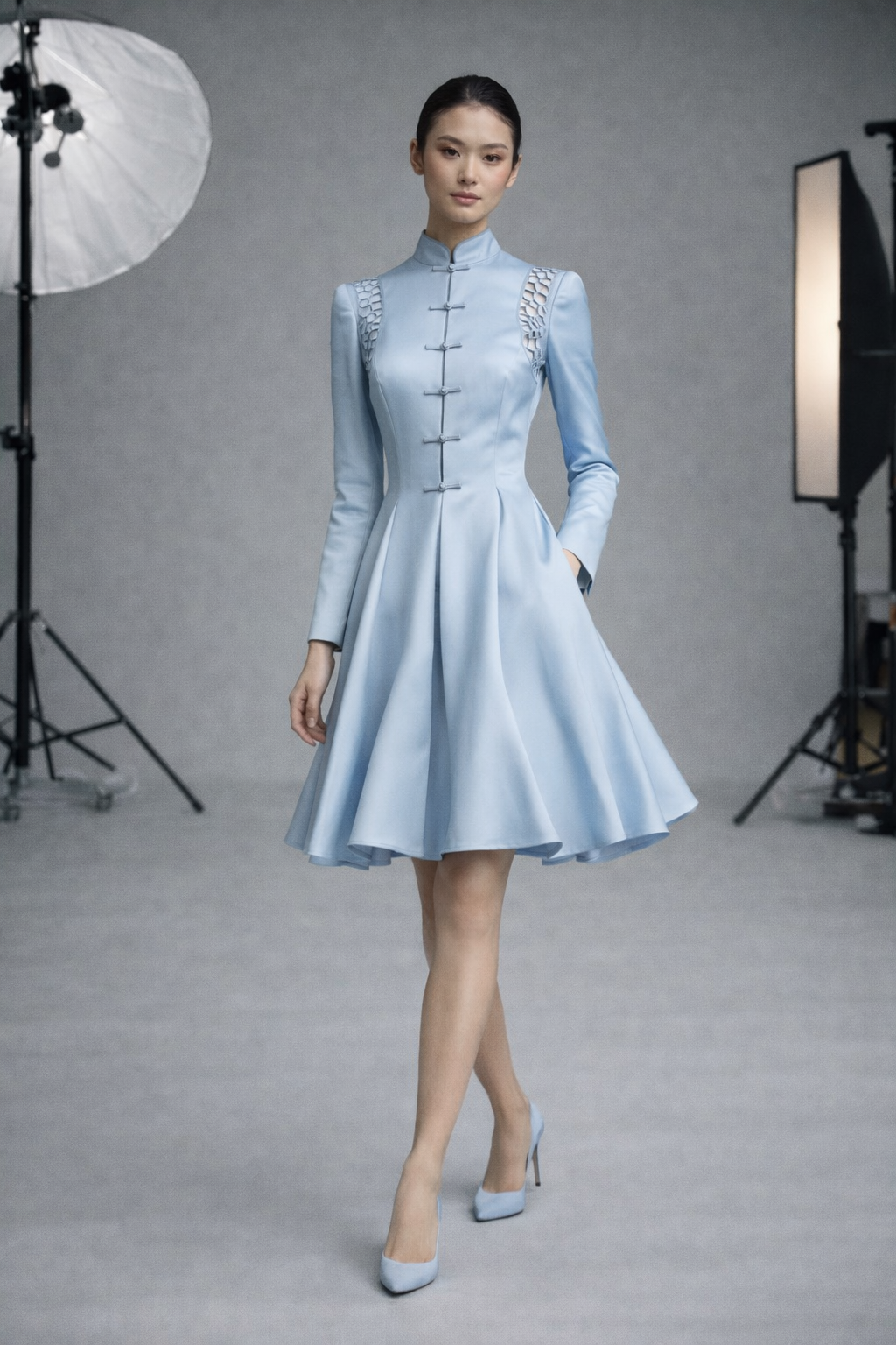 Model in knee length full skirted dress long sleeves satin blend Chinese style collar and  front fastnings in  ice blue